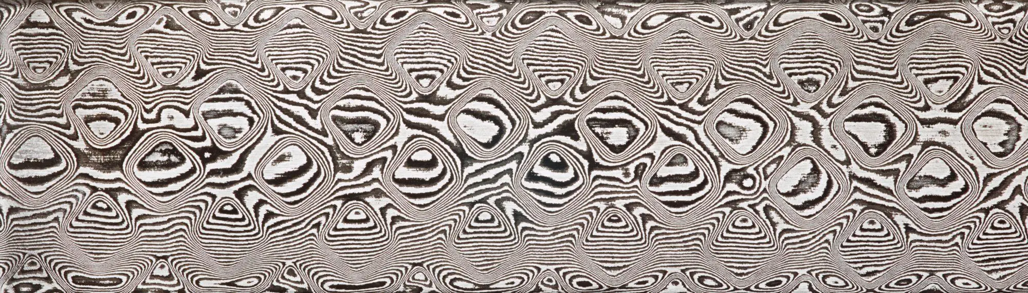 Etched DSC Carbon billet in the Large Pyramids pattern, shown enlarged